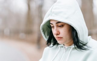 woman looking anxious staring at ground