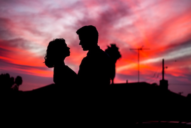 silhouette of a couple against a sunset sky