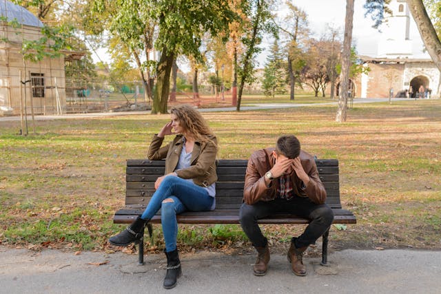 couple arguing in a bench
