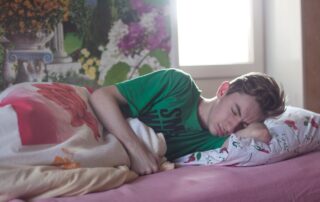 Man Wearing Green Printed Crew-neck Shirt While Sleeping