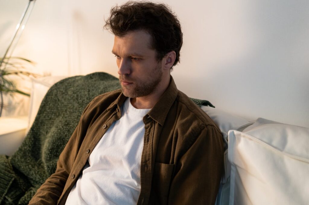 a-sad-man-sitting-on-a-sofa