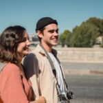 woman-holding-on-to-man-s-arm-while-walking
