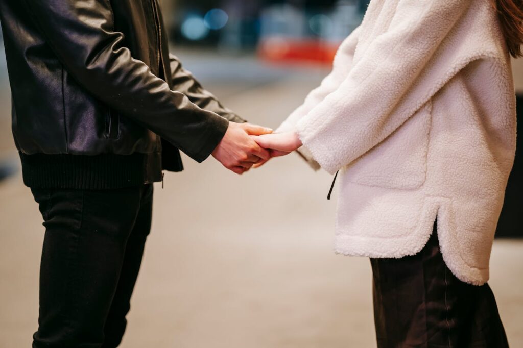 couple-holding-hands-on-street