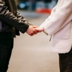 couple-holding-hands-on-street