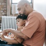 man-and-his-son-sitting-on-the-floor