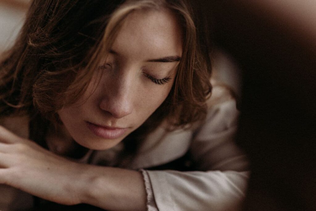 portrait-of-pensive-woman-with-eyes-closed