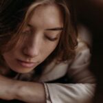 portrait-of-pensive-woman-with-eyes-closed